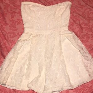 A floral white lace strapless romper